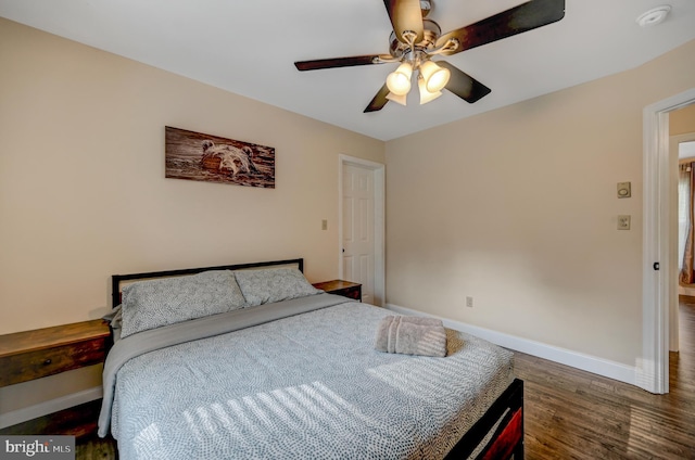 bedroom featuring ceiling fan and dark wood-type flooring