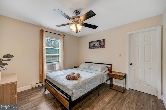 bedroom featuring ceiling fan, dark hardwood / wood-style floors, and a baseboard heating unit