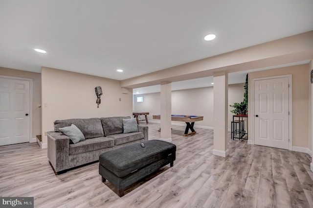 living room featuring light hardwood / wood-style floors and pool table