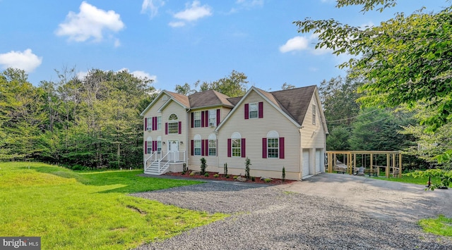 view of front of home featuring a garage and a front lawn