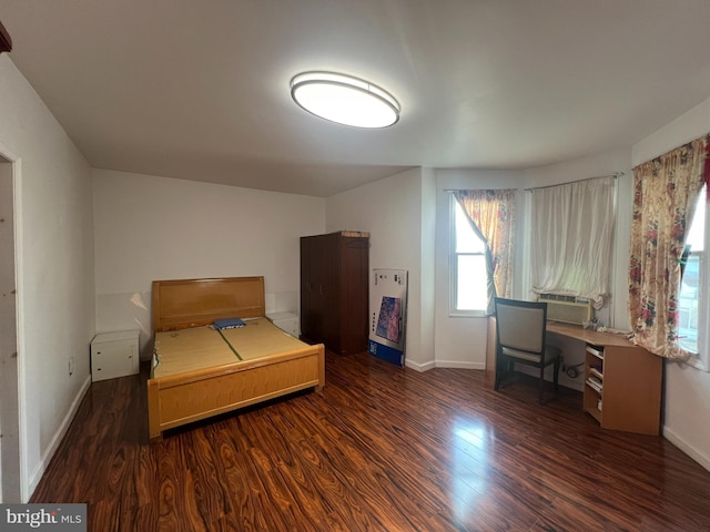 bedroom with dark hardwood / wood-style floors and cooling unit