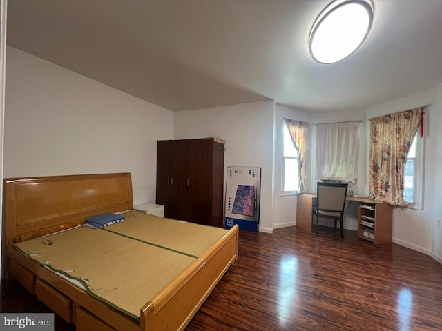 bedroom featuring dark hardwood / wood-style flooring