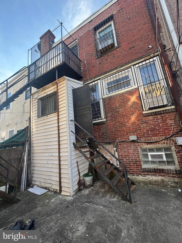 view of property exterior with a balcony