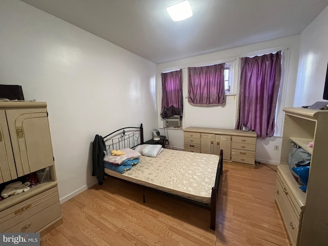 bedroom with light wood-type flooring