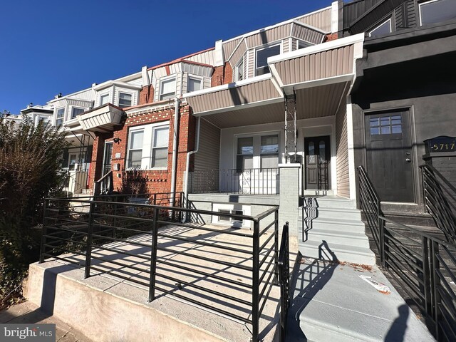 view of property with a porch