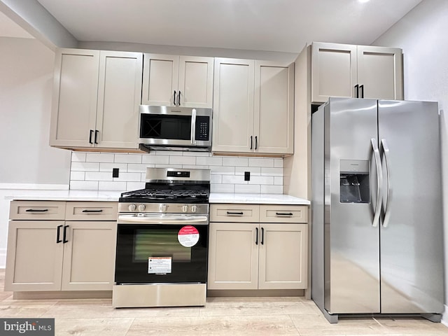 kitchen featuring backsplash and stainless steel appliances