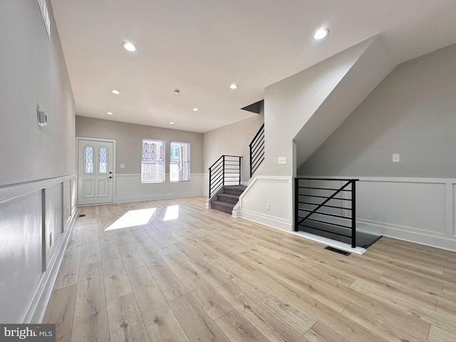 unfurnished living room featuring light hardwood / wood-style flooring