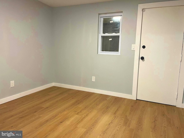 spare room with light hardwood / wood-style floors