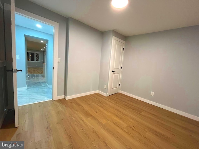 unfurnished room with light hardwood / wood-style flooring