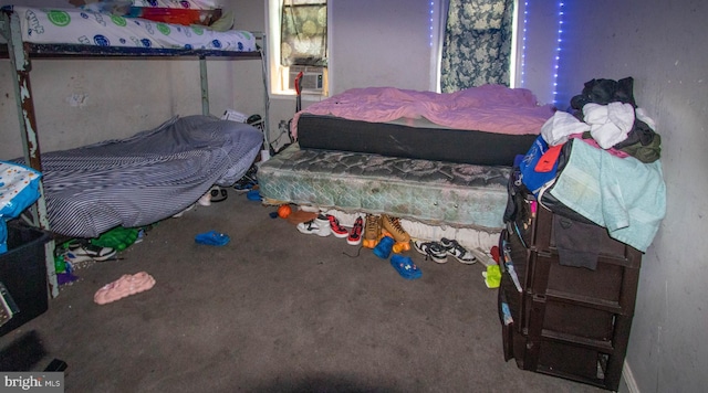 bedroom featuring carpet and cooling unit