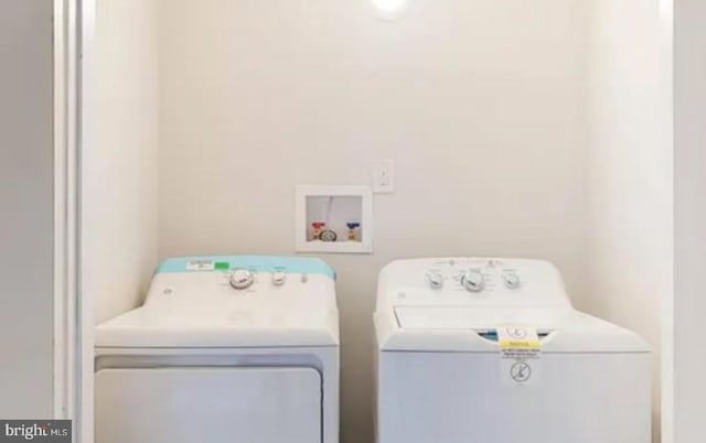 washroom featuring separate washer and dryer