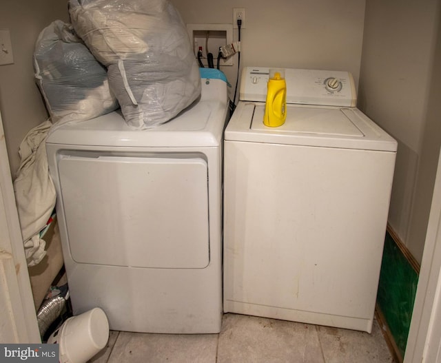 washroom with washer and dryer