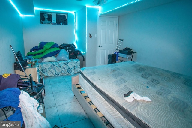 bedroom with light tile patterned floors