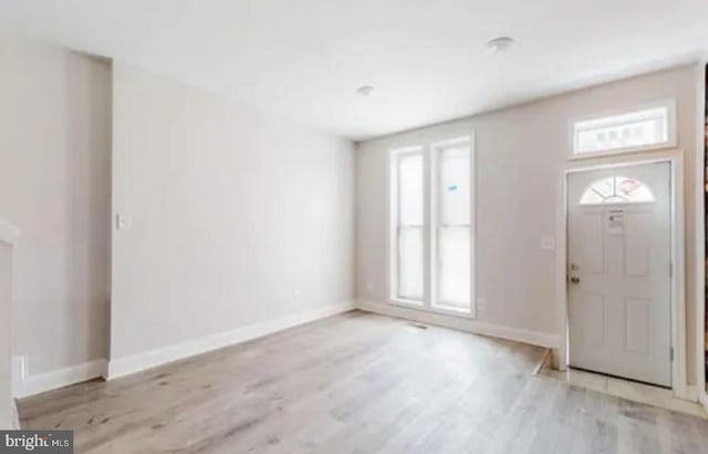 foyer with light wood-type flooring