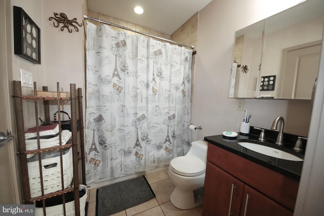 bathroom with tile patterned floors, vanity, and toilet