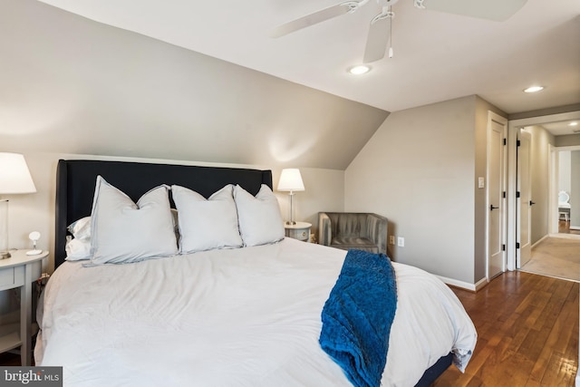 bedroom featuring ceiling fan, dark wood-type flooring, and vaulted ceiling