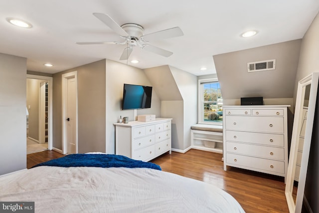 bedroom with a closet, ceiling fan, and dark hardwood / wood-style flooring