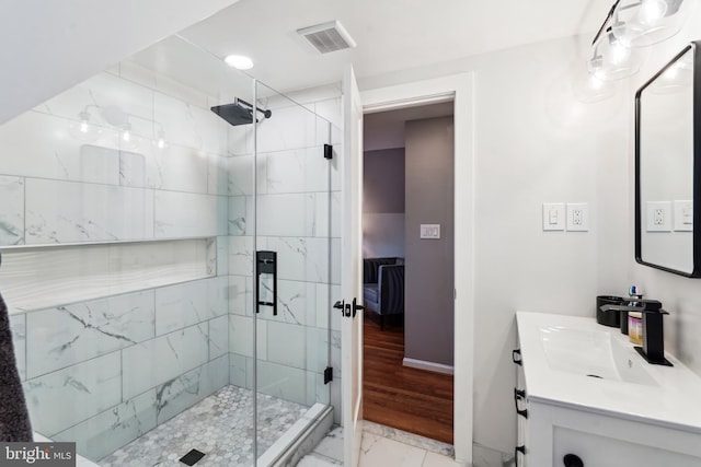 bathroom with vanity and an enclosed shower