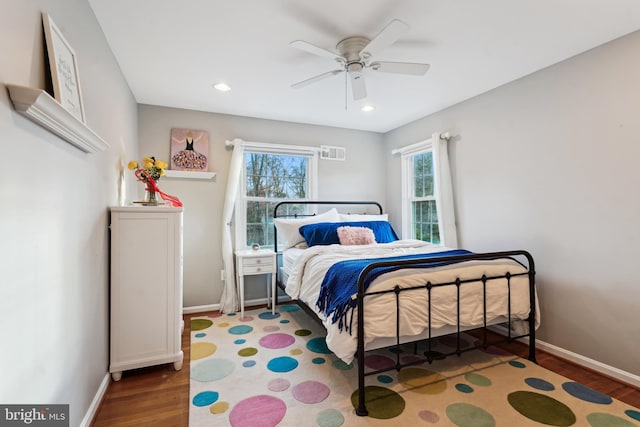 bedroom with wood-type flooring and ceiling fan