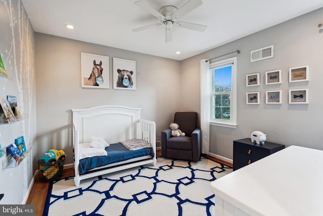 bedroom featuring ceiling fan and light hardwood / wood-style flooring