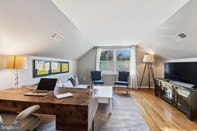 office area with lofted ceiling and light wood-type flooring