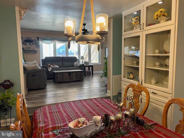 dining space with hardwood / wood-style flooring