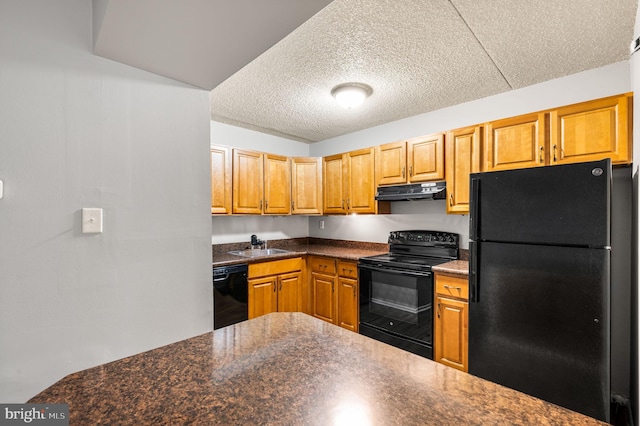 kitchen featuring sink, a textured ceiling, and black appliances