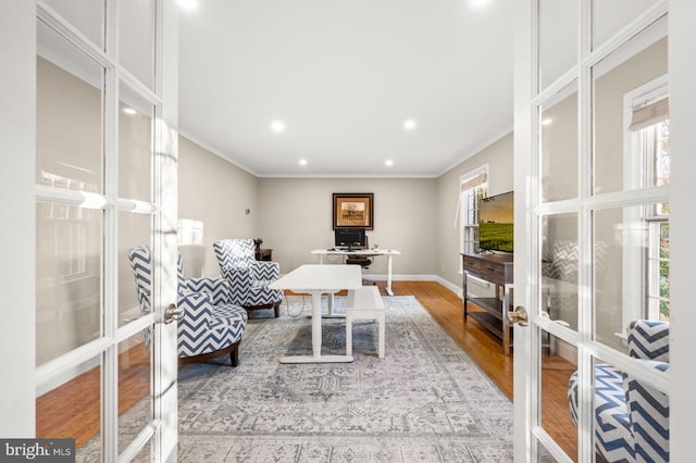 office space with french doors, crown molding, and hardwood / wood-style floors