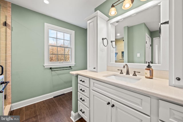 bathroom featuring hardwood / wood-style floors and vanity