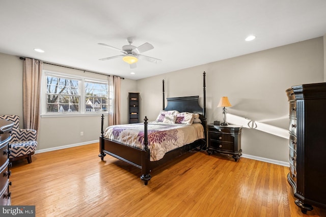 bedroom with light hardwood / wood-style floors and ceiling fan