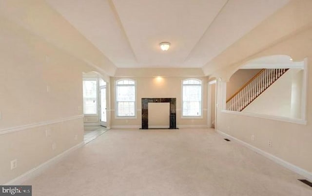 6614 Quander Rd, Alexandria, VA 22307 - unfurnished living room featuring a tiled fireplace and carpet