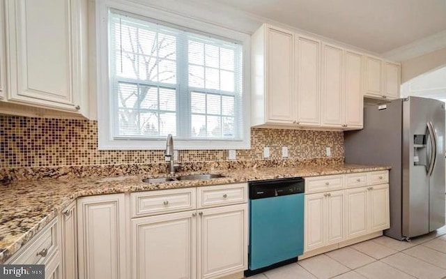 6614 Quander Rd, Alexandria, VA 22307 - kitchen featuring decorative backsplash, light stone counters, stainless steel appliances, sink, and light tile patterned flooring