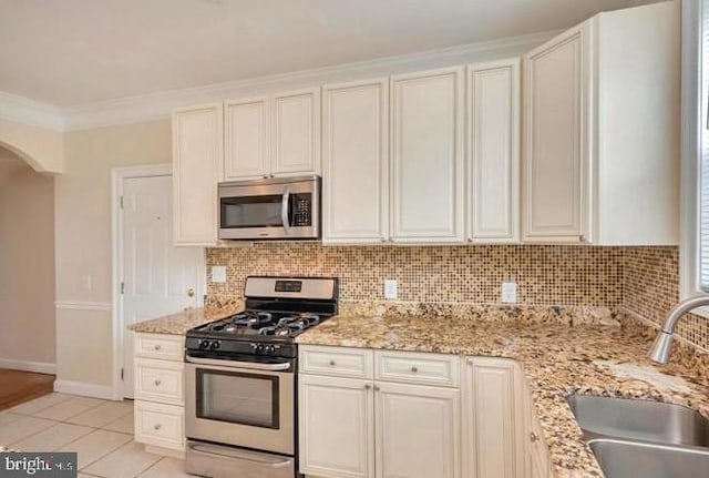 6614 Quander Rd, Alexandria, VA 22307 - kitchen featuring sink, stainless steel appliances, light stone counters, backsplash, and ornamental molding