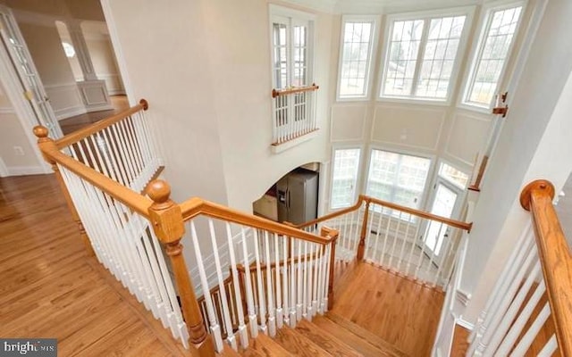 6614 Quander Rd, Alexandria, VA 22307 - stairway with a high ceiling and hardwood / wood-style flooring