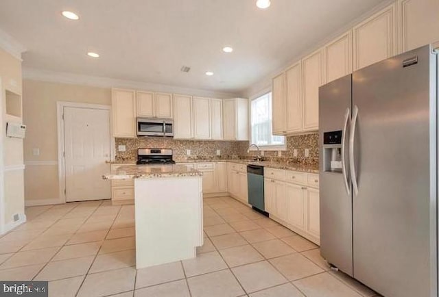 6614 Quander Rd, Alexandria, VA 22307 - kitchen with a kitchen island, light tile patterned flooring, stainless steel appliances, and tasteful backsplash