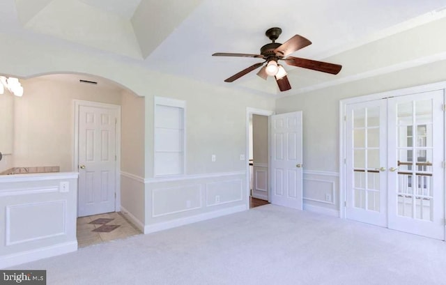 6614 Quander Rd, Alexandria, VA 22307 - unfurnished bedroom with ceiling fan, french doors, and light colored carpet