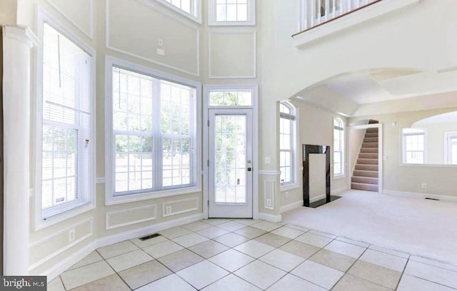 6614 Quander Rd, Alexandria, VA 22307 - foyer featuring light colored carpet and a healthy amount of sunlight