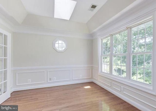 6614 Quander Rd, Alexandria, VA 22307 - unfurnished room with a skylight and light hardwood / wood-style flooring