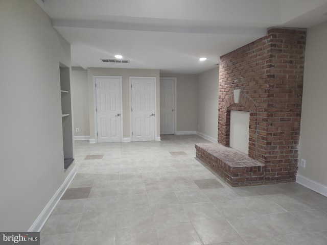 6614 Quander Rd, Alexandria, VA 22307 - unfurnished living room with light tile patterned floors and a fireplace