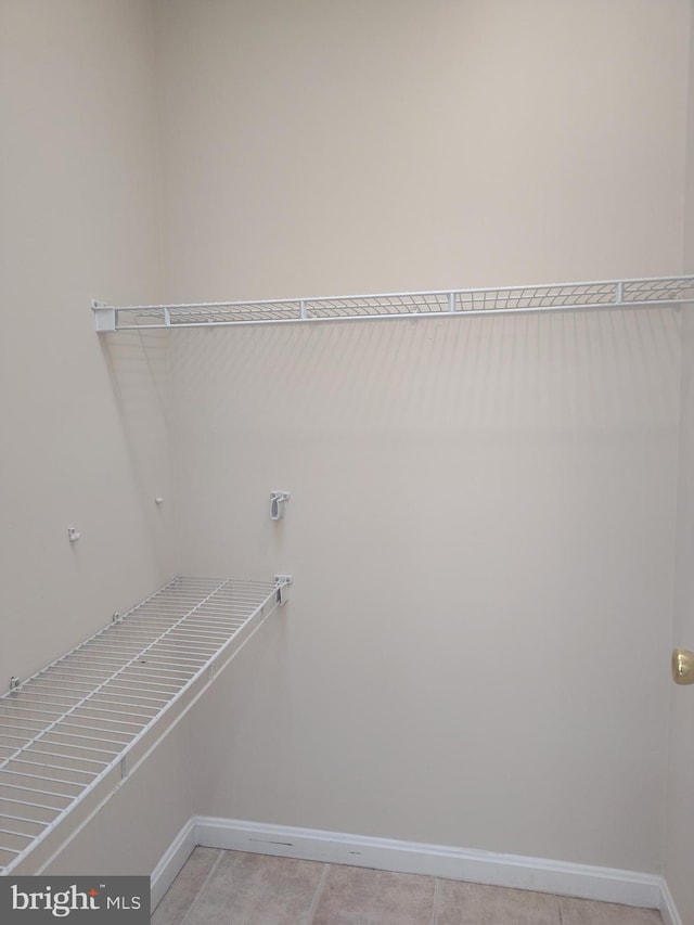 6614 Quander Rd, Alexandria, VA 22307 - laundry area featuring hookup for an electric dryer and light tile patterned floors