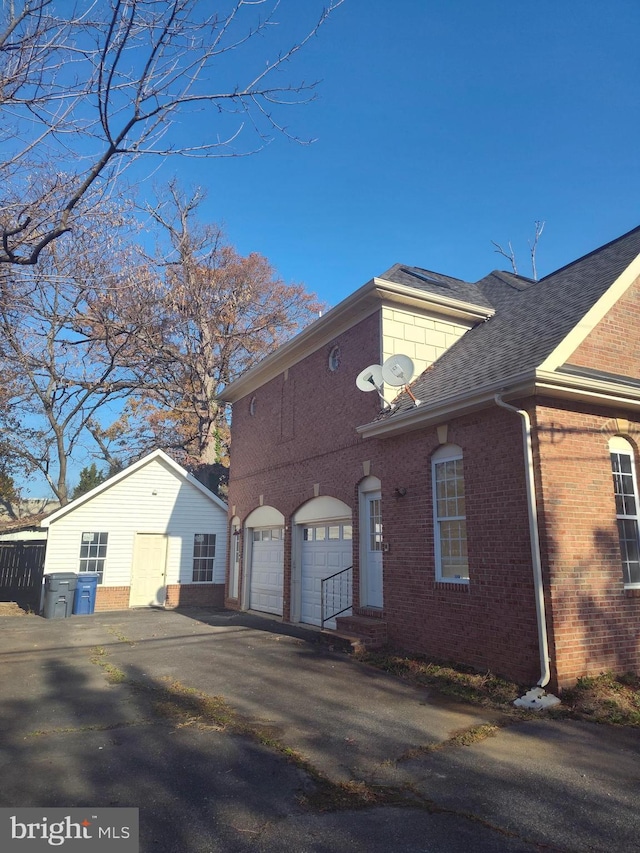 6614 Quander Rd, Alexandria, VA 22307 - view of home's exterior with a garage