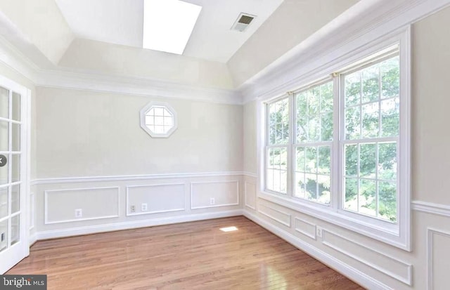 6614 Quander Rd, Alexandria, VA 22307 - unfurnished room with a skylight and light hardwood / wood-style flooring