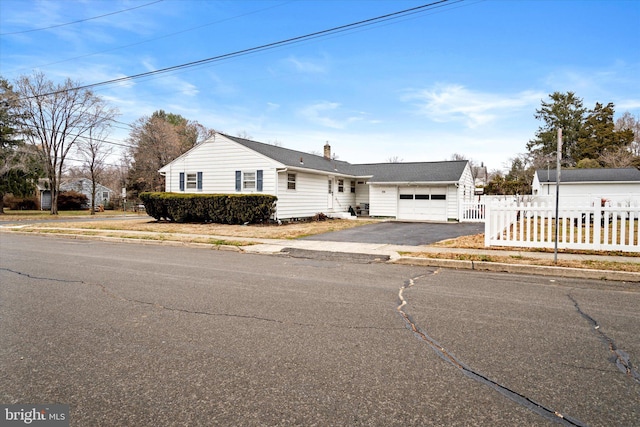 single story home with a garage