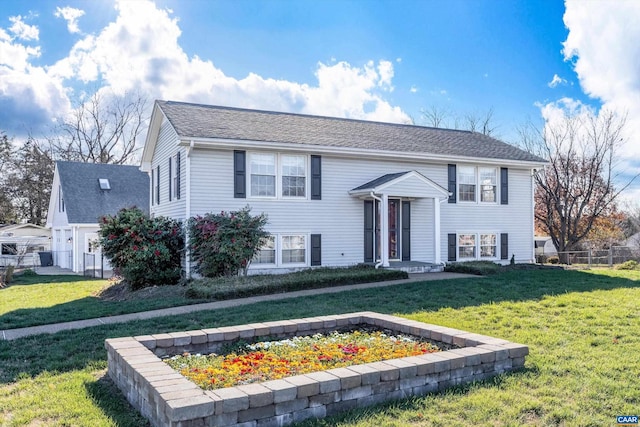 bi-level home featuring a front yard