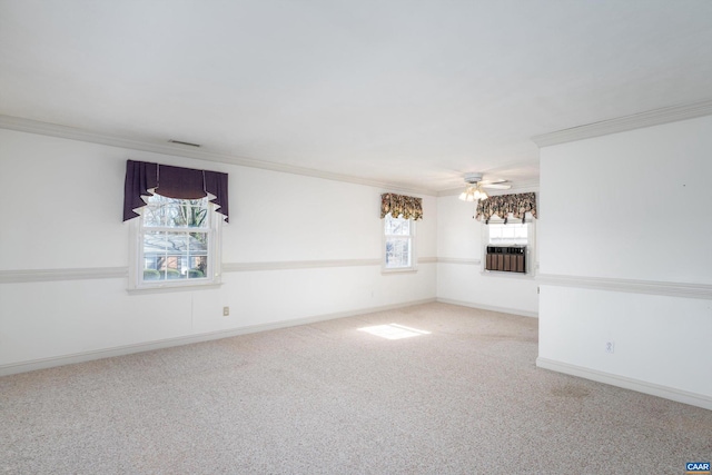 interior space with crown molding, carpet, and a healthy amount of sunlight