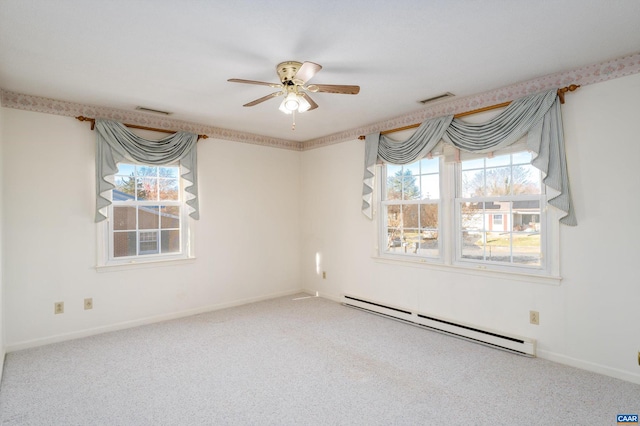 carpeted spare room with baseboard heating and ceiling fan