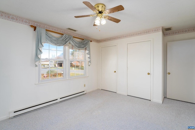 unfurnished bedroom with baseboard heating, ceiling fan, and light colored carpet