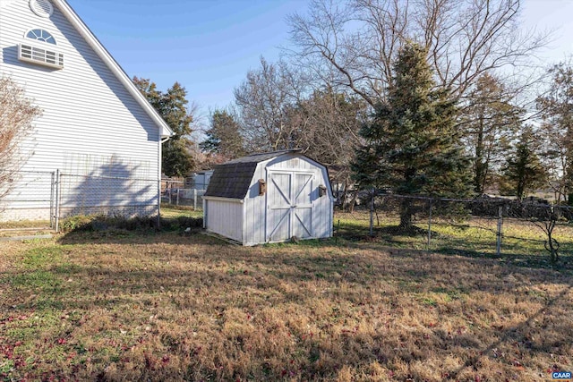 view of outbuilding featuring a yard