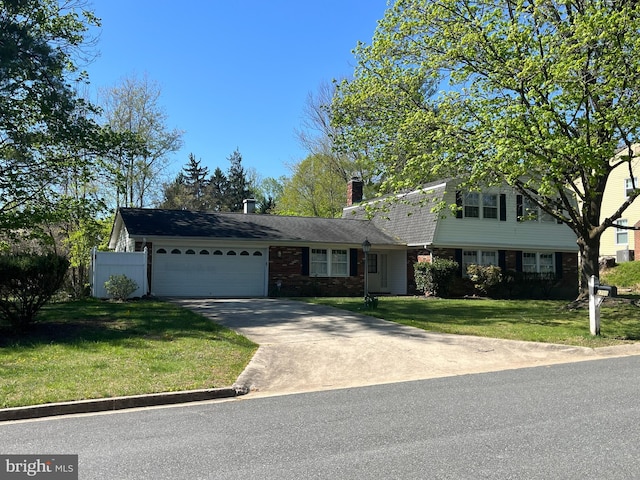 2700 Bellmawr Ct, Silver Spring, MD 20906 - view of front of property featuring an attached garage, concrete driveway, a front yard, a chimney, and brick siding