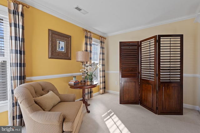 living area featuring light carpet and crown molding